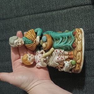 Bibelot of grandmother and granddaughter knitting .